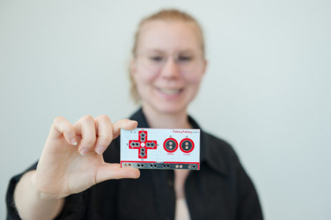 Person holding a Makey Makey Person holding a Makey Makey